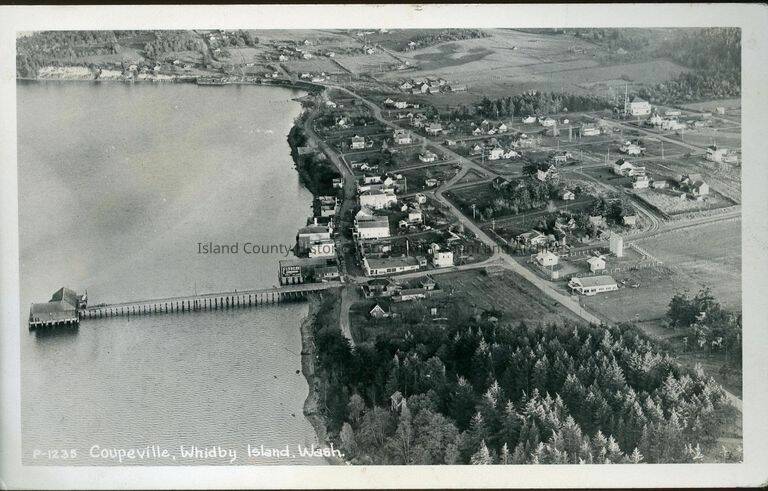 Photo provided. 
A postcard depicting an aerial view of historic Coupeville, including Front Street, the Wharf and Alexander Blockhouse.