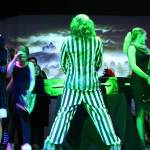 (Photos by Marina Blatt) Ray Graham Ray as Beetlejuice, pretends to pee on stage as bystanders act disgusted.