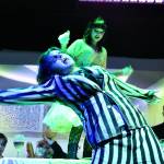 (Photo by Marina Blatt) Beetlejuice dances with glee during a chaotic dinner table scene.
