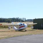 A plane and the airports vast property behind it (Photo by Allyson Ballard).