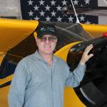 Robert DeLaurentis poses in front of one of his planes (Photo by Allyson Ballard).