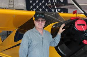 Robert DeLaurentis poses in front of one of his planes (Photo by Allyson Ballard).