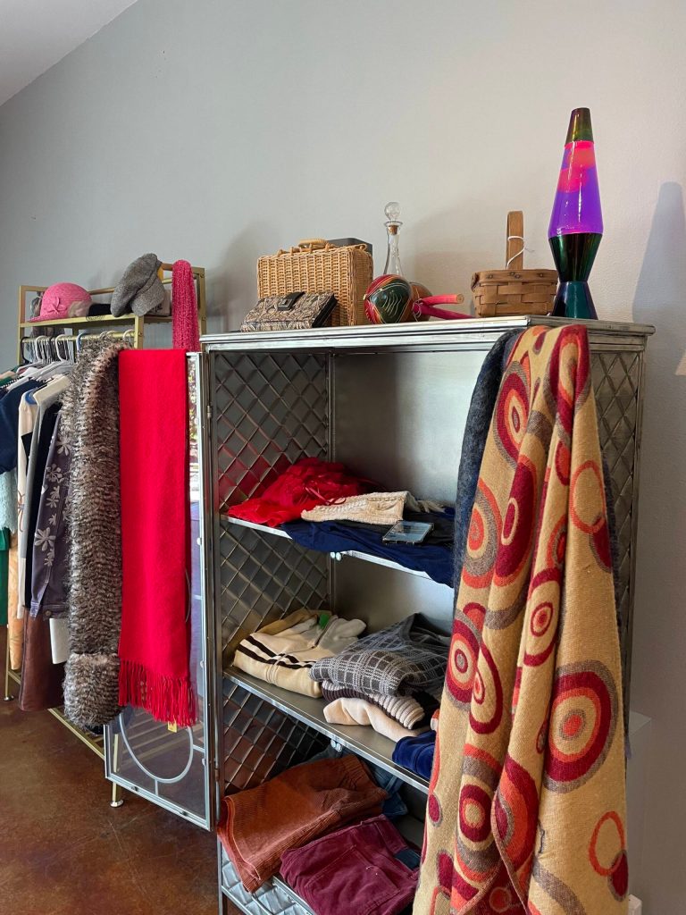 (Photo by Marina Blatt). The vintage shop contains nostalgic pieces like a lava lamp.