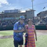 (Photo provided) Singer Mira Arcilla stands next to Everett AquaSox On-Field Emcee Steve Willits.