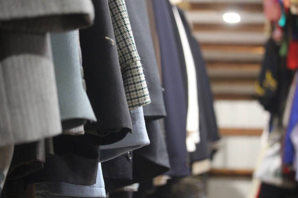 (Photo by Marina Blatt) Browse a wide range of suits at the garage sale.