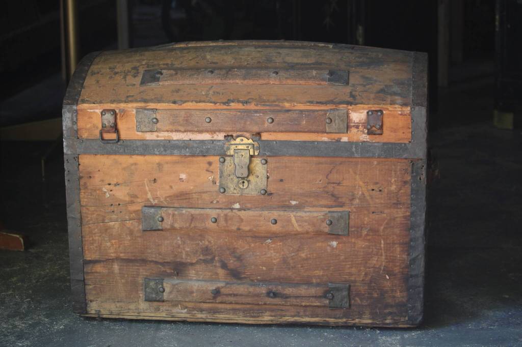 (Photo by Marina Blatt) A charming treasure chest at the garage sale is just the thing to bury in the sand for your kids to dig up on their next backyard adventure.