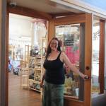 (Photo by Marina Blatt) Kilpatrick holds the shop door open, inviting customers in.