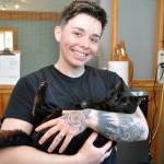 (Photo by Mary Jo Adams) Animal care technician Morgan Kenaley with Shadow at the Freeland Cat Cottage.