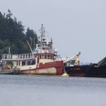 (Photo by Marina Blatt) The sinking Shark Lady is sandwiched between a hazmat rescue vessel on the left, and the San Juan Enterprise, on the right, which is certified by the U.S. Coast Guard to legally haul flammable liquids, according to its website.