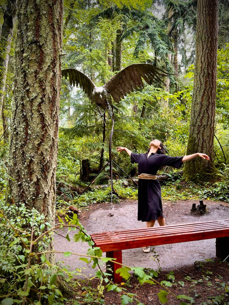 (Photo provided) A dancer spreads her arms, a mirror of the sculpture of the bird behind her.