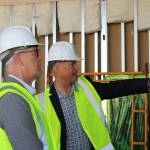 (Photo by Allyson Ballard) Principal Architect of NAC Architecture Philip Riedel informed tour attendants of Crescent Harbors new features, like the addition of solar panels.