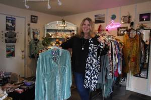(Photo by Marina Blatt) Vicki Yount shows off the colorful clothing she sells in V-Boutique.