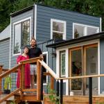 Photo by David Welton
Chanel Jost and Tevon Dubois stand on the front porch of their upcycled home.