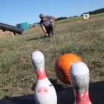 (Photo by Marina Blatt) Steve Hiborn plays pumpkin bowling.