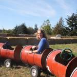 (Photo by Marina Blatt) Shannon Hilborn enjoys a barrel train ride in train carts built by her husband and herself.