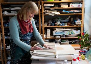 StillFire Potterys Carol Ann Bauer forms platters out of clay at her home in Freeland. (Olivia Vanni / The Herald)