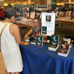 Kim Hornsby signs some of her books at an author event in a Barnes & Noble. (Photo provided)
