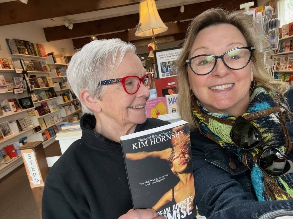 Kim Hornsby with Josh Hauser, owner of Moonraker Books in Langley. (Photo provided)