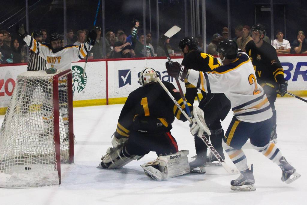 (Photo by Allyson Ballard) Eric Hewitt, a Navy defenseman wearing number two here, is one of six players stationed at Naval Air Station Whidbey who played in Saturdays game.