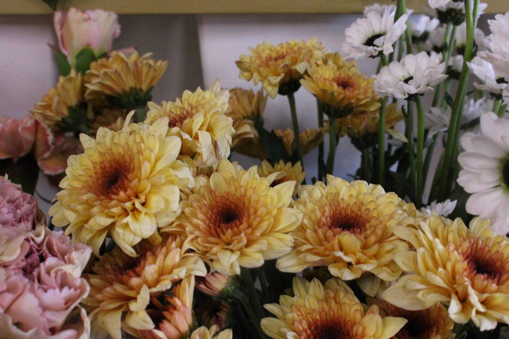 (Photo by Allyson Ballard) Blooms and Bites boasts just that  an eye-catching display of fresh, locally grown flowers and an assortment of tasty snacks.