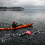 (Photo provided by Sailing with Paul Porter) Nuzzolillo completed her swim flanked by her husband, Evan, and her friend, Paul.
