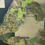 Photo by Allyson Ballard
Green indicates the territory of the previous sampling areas, and blue indicates the territory of the expanded 2025 sampling areas on a map at the meeting.