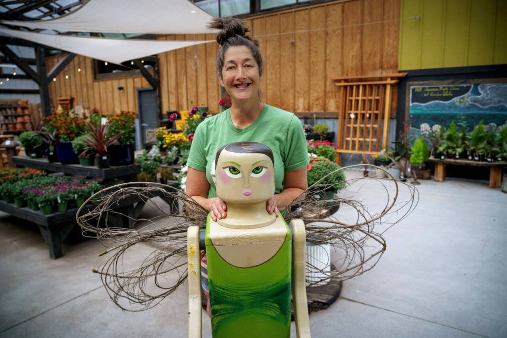Photo by David Welton
Artist Jennifer Ann with Hazel, the Woodbey outside of Venture Out Nursery in Clinton. The woodland fairy is inspired by Art Deco style and Disney princesses.