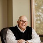 (Photo provided) The CEO and author, Douglass Shaw sits at his desk.