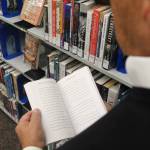 (Photo by Marina Blatt) Douglass Shaw reads a copy of his latest book, Curative Culture.