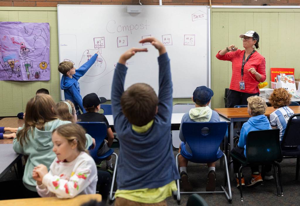 Anders Sherrett helps explain the steps fellow students need to follow for class at South Whidbey Elementary School on Sept. 22, 2025 in Langley, Washington. (Olivia Vanni / The Herald)