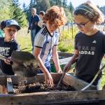 Olivia Vanni / The Herald
Trenton Sankey dumps compost onto a wire frame for Winston Harper and Blake Bishop to sift the compost during class at South Whidbey Elementary School on Sept. 22, 2025, in Langley, Washington.