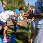 Dylan Blank washes his hands before going to pick vegetables in the garden during class at South Whidbey Elementary School on Sept. 22, 2025 in Langley, Washington. (Olivia Vanni / The Herald)