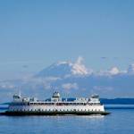 (Photo by David Welton) A ferry on the Coupeville-to-Port Townsend route cruises with Mount Rainier in the background.