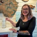 (Photo by David Welton) Kara Peabody shows the original jar of messages she collected about community on South Whidbey.