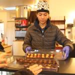 Photo by Marina Blatt
Jaden Varljen, an employee, serves up chocolates.