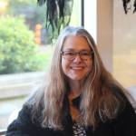 Ramona Newbauer smiles inside her store, Sweet Monas.