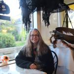 Photo by Marina Blatt
Newbauer sits among her boutiques Halloween decor.