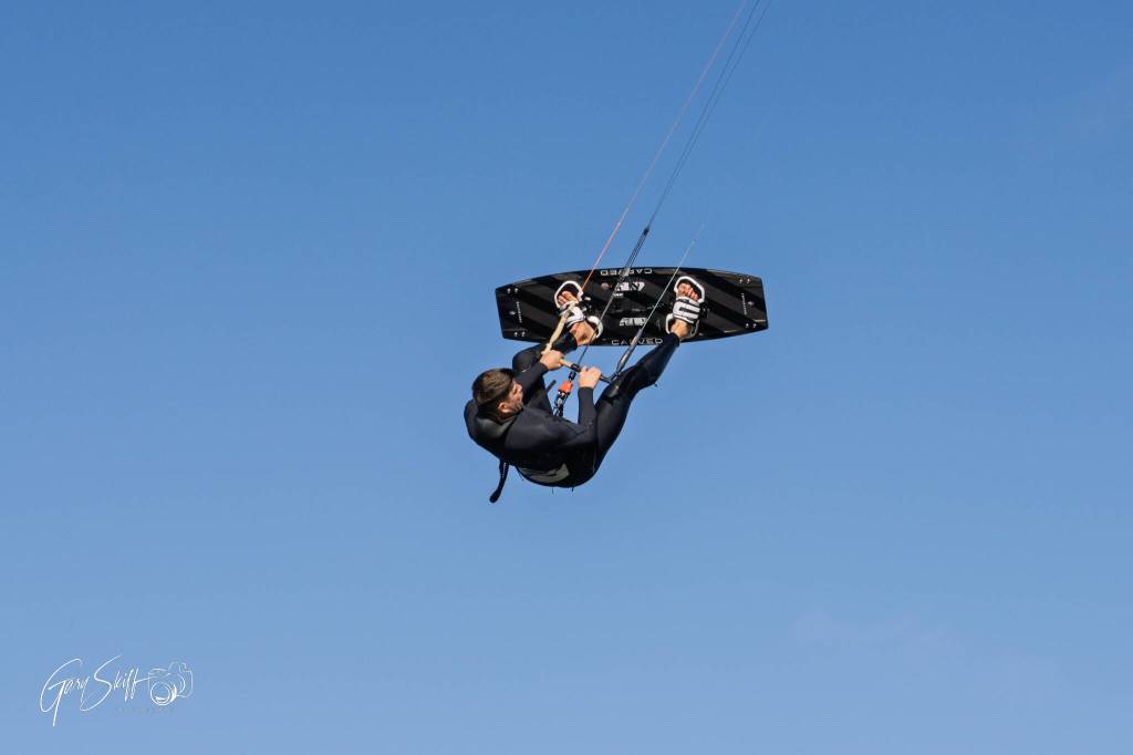 (Photo by Gary Skiff) Martin Anderson hangs upside down, appearing frozen in time.