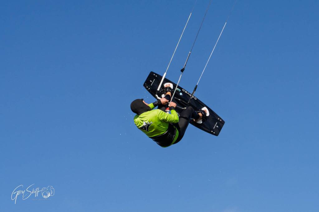 (Photo by Gary Skiff)	All that is preventing Stewart Sykes from falling out of the air are his feet strapped on the board and his strong grip.