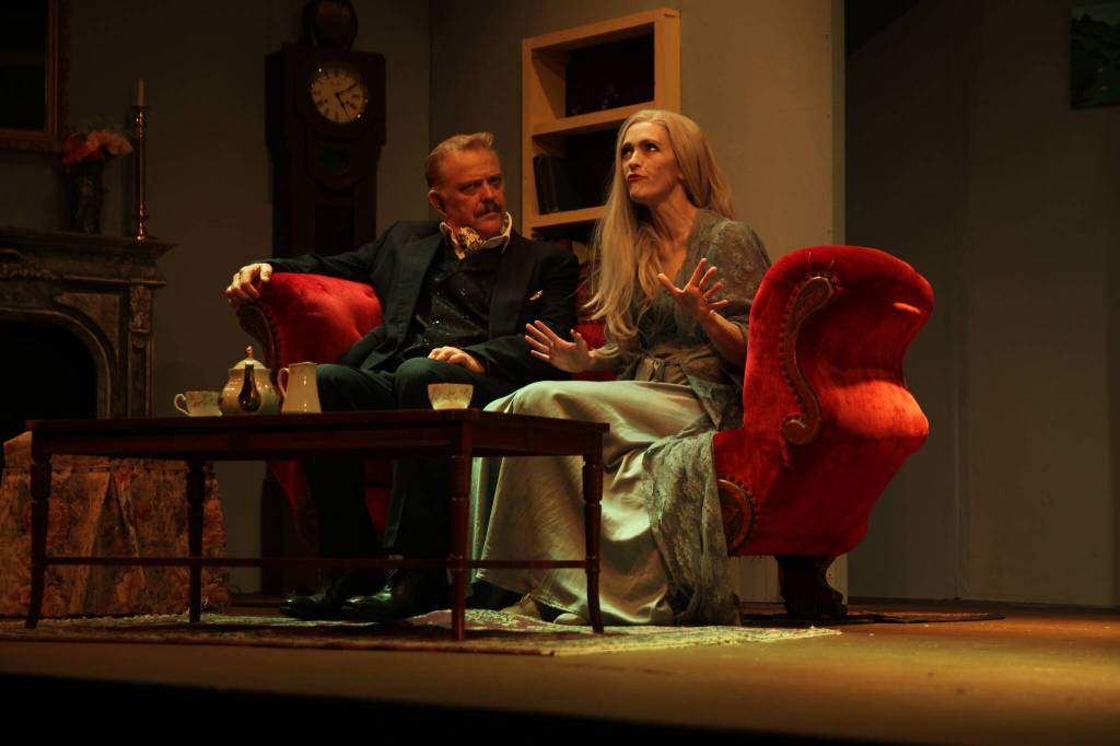 Lachlan Waterbury (Charles) and Abby Thuet (Elvira) bicker over who summoned Elviras ghost. (Photo by Marina Blatt)