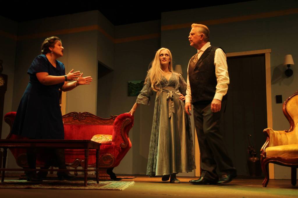 Elvira turns the husband and wife against each other. From left are Shealyn Christie (Ruth), Abby Thuet (Elvira) and Lachlan Waterbury (Charles). (Photo by Marina Blatt)