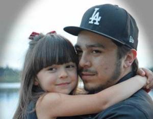Garcia hold his daughter, Sophia.
