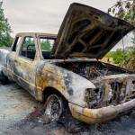 Photo by David Welton
Island County Commissioners are wondering if more can be done to reduce the cost of hauling old and abandoned vehicles, such as this one that suffered catastrophic damage from a fire.