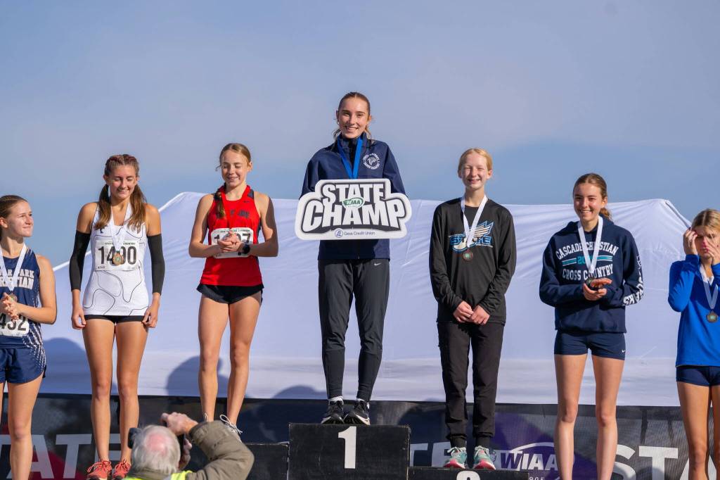 Reed Atwood stands at the top of the podium following the race.