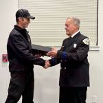 Fire Chief Jerry Helm congratulates Bob Moore on 15 years of volunteer service at a ceremony earlier this month. (Photo by Central Whidbey Island Fire and Rescue)