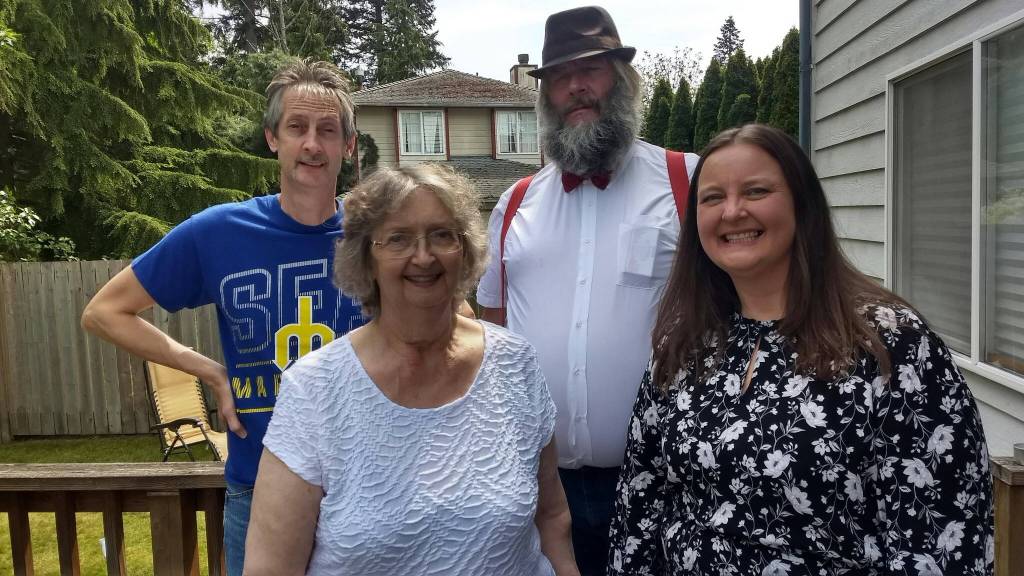 Jeff Pangburn takes a family photo with Cheryl Rafert, Jon Larson and Donna Pangburn.
