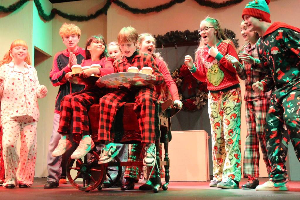 Photos by Marina Blatt
Children in the Cocoa Car Crew sing and dance to Hot Chocolate, from the Polar Express. Its not really hot chocolate in the cups, Samantha Howard said, but keep it on the DL.