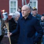 (Photo provided by the Chabad Jewish Center of Skagit County) A man prepares to light the giant menorah with a giant torch, of course.