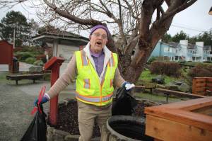 Photo by Marina Blatt
Lachlan Waterbury, the singing Coupeville janitor, belts out a tune while emptying garbage cans around town.