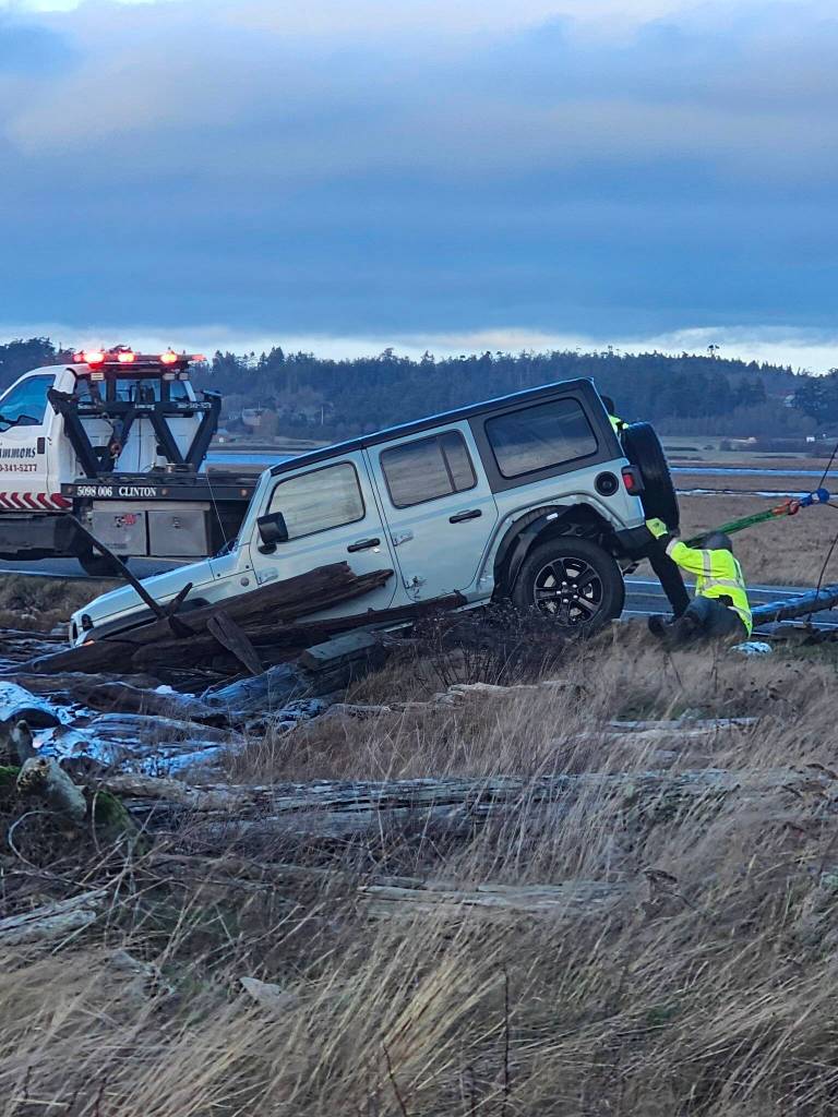 Photo by Mel Nasby. A vehicle crashed into a pond at the intersection of Highway 20 and Keystone Avenue on Dec. 20.
